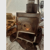 portable esker wood stove, set up in an esker tent 