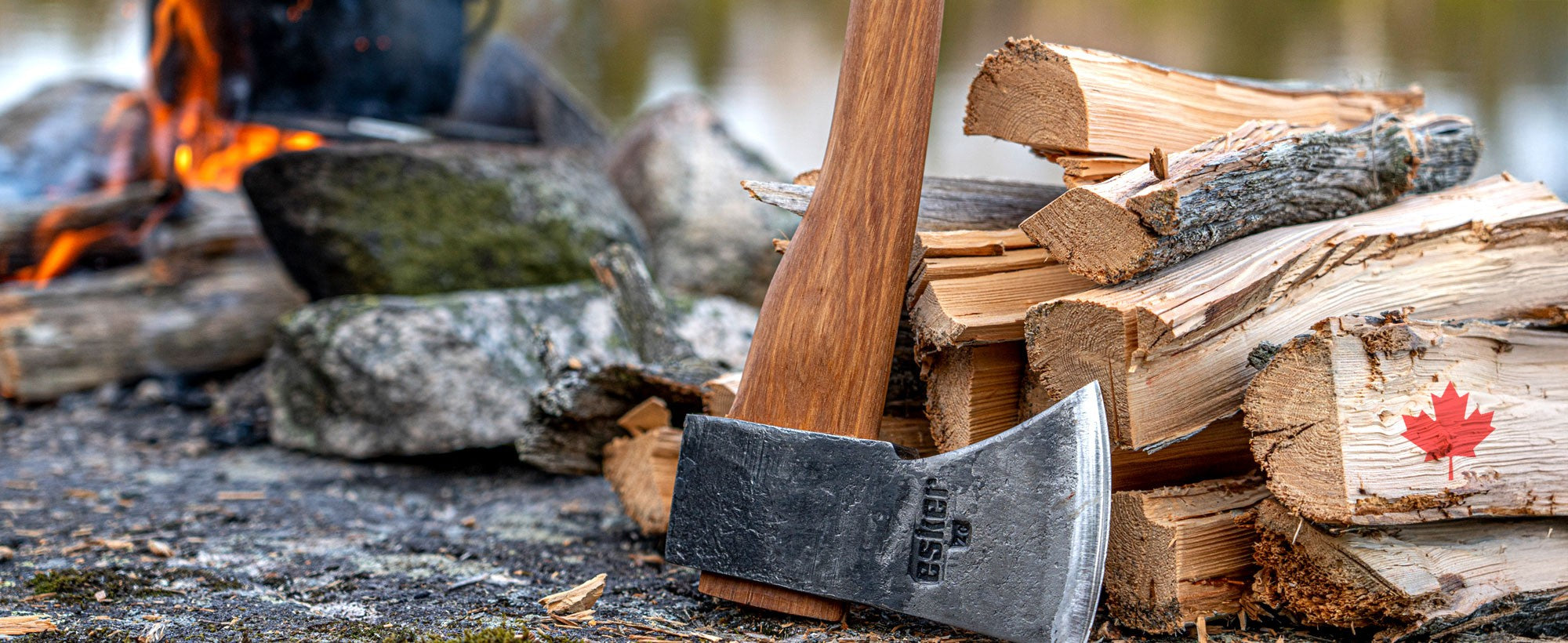 Esker Axe leaning against a woodpile 