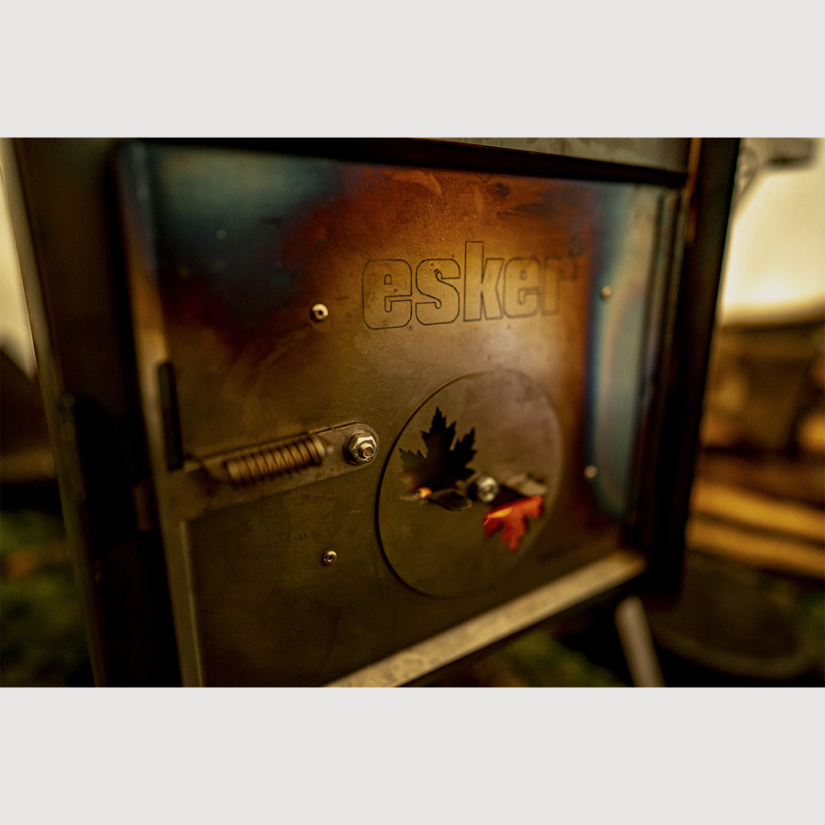 Close up of the esker baffin stove with esker logo and maple leaves
