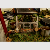 close up of the esker portable wood stove snow float legs