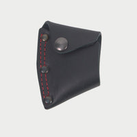 Black leather hatchet mask  with red stitching on a light gray background