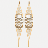 Pair of traditional snowshoes on a light grey background 