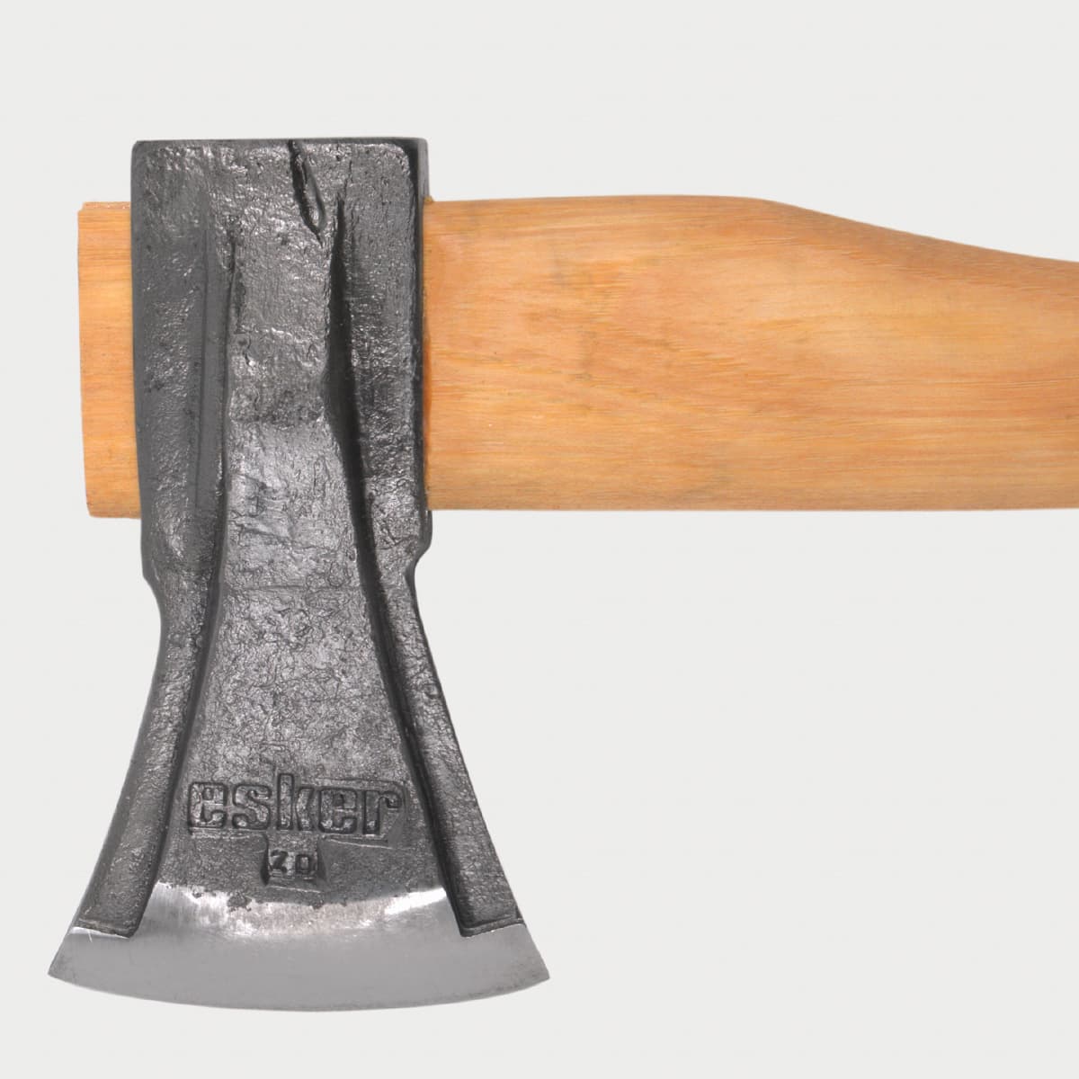 close up of the esker splitter, showing the logo stamped into the axe head, on a wooden handle. 