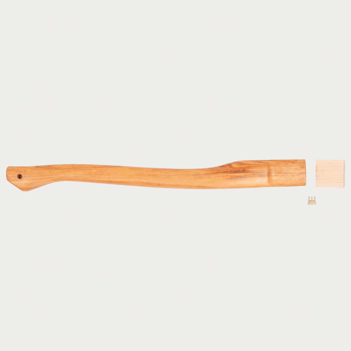 Wooden hatchet handle, with mounting hardware, on a light gray background