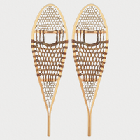 Pair of Esker traditional snowshoes with hand-woven rawhide webbing